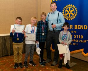 Anthony Poponi with a group of students at a Rotary Club's “Invention Convention,” which showcases elementary school finalists showing of their inventions.